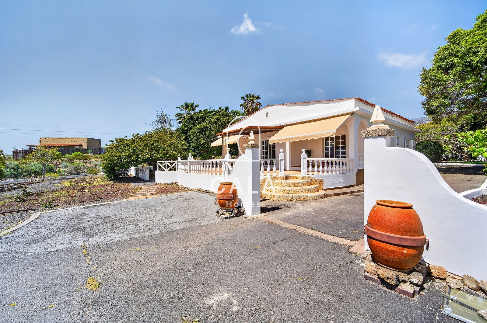 Country house with land and sea views.