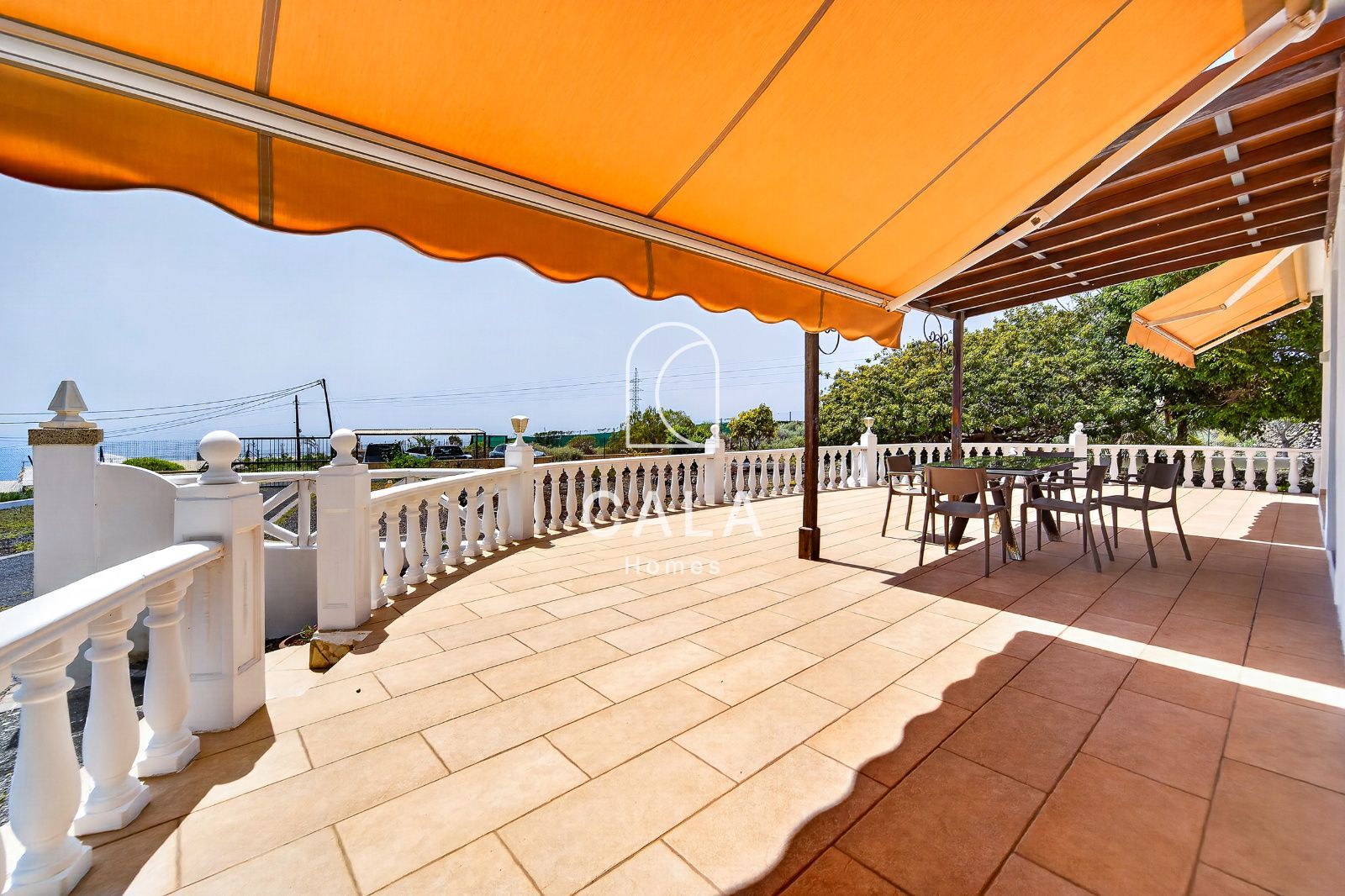 Country house with land and sea views.