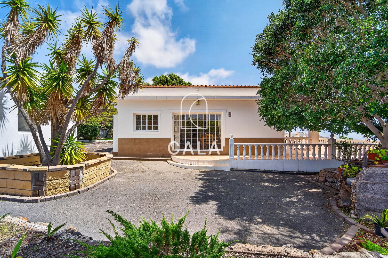 Country house with land and sea views.