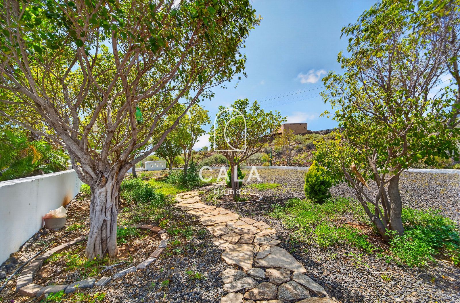 Country house with land and sea views.
