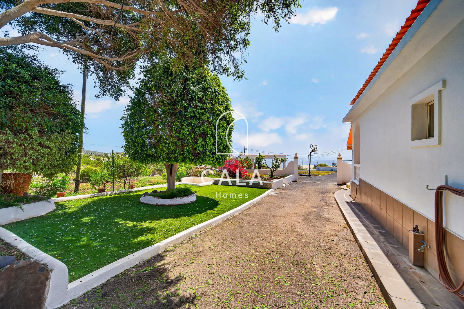 Country house with land and sea views.