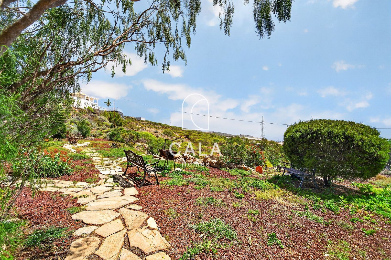 Country house with land and sea views.